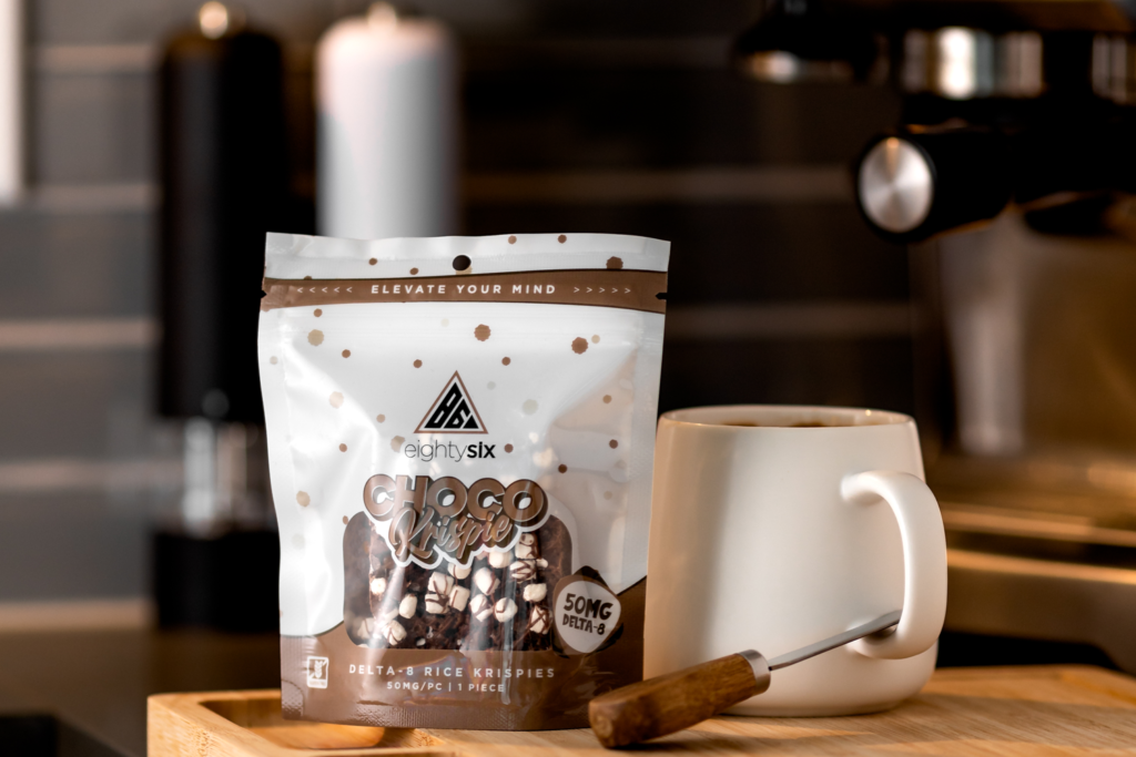 A pack of choco krispie placed along with white mug